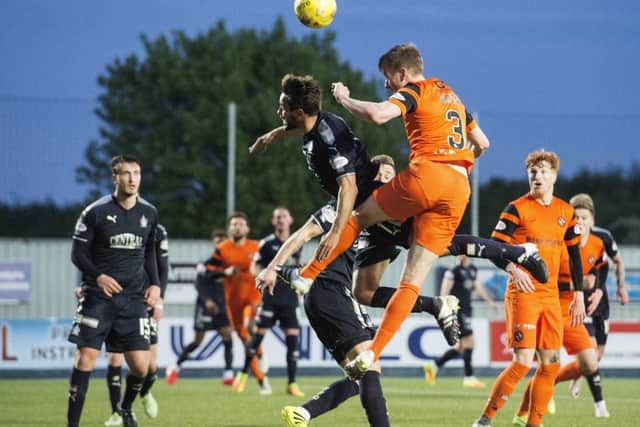 Dundee United's Paul Dixon puts his side ahead in the closing minutes of the Premiership semi-final play-off against Falkirk. Picture: Alan Harvey/SNS