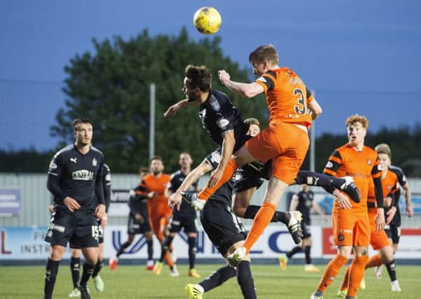 Dundee United's Paul Dixon puts his side ahead in the closing minutes of the Premiership semi-final play-off against Falkirk. Picture: Alan Harvey/SNS