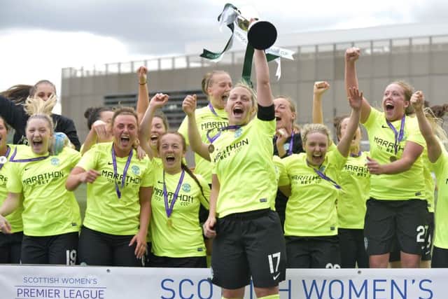 Captain Joelle Murray raises the SWPL Cup after Hibernian Womens 4-1 win in the final. Picture: Lorraine Hll.
