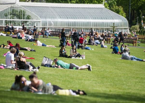 Sunbathers in the Glasgow Botanic Gardens. Glasgow could reach 23C on Friday. Picture: John Devlin
