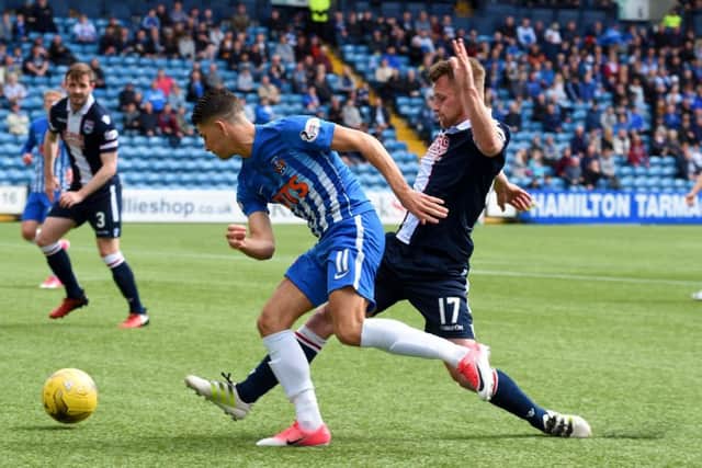 Kilmarnock's Jordan Jones wins a penalty after being brought down by Jonathan Franks. Pic: SNS/Bill Murray