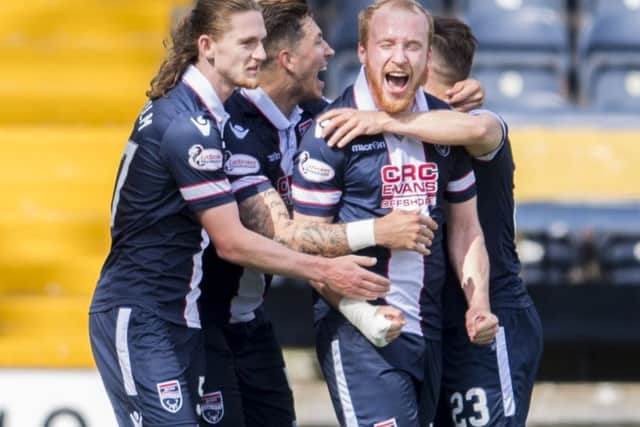 Ross County's Liam Boyce celebrates with team-mates. Pic: SNS/Bill Murray
