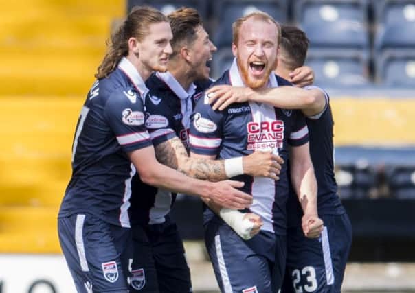 Ross County's Liam Boyce celebrates with team-mates. Pic: SNS/Bill Murray