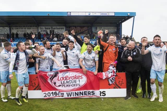 Forfar players celebrate promotion to Ladbrokes League One. Pic: SNS/Gary Hutchison