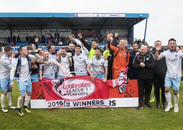 Forfar players celebrate promotion to Ladbrokes League One. Pic: SNS/Gary Hutchison