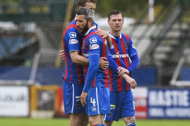 Inverness CT's Kevin McNaughton is comforted at full-time. Pic: SNS/Craig Williamson
