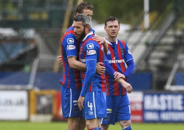 Inverness CT's Kevin McNaughton is comforted at full-time. Pic: SNS/Craig Williamson