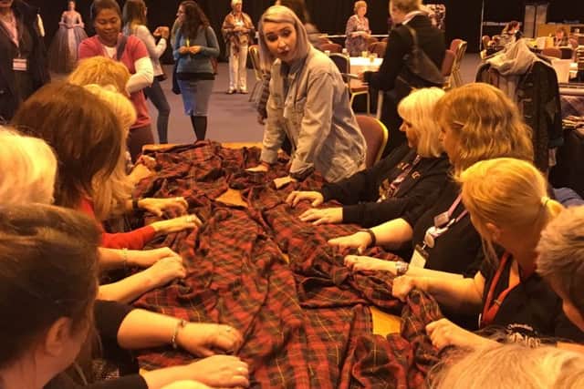 Guest join in wool waulking workshop and learn a Gaelic song. PIC: Contribted.