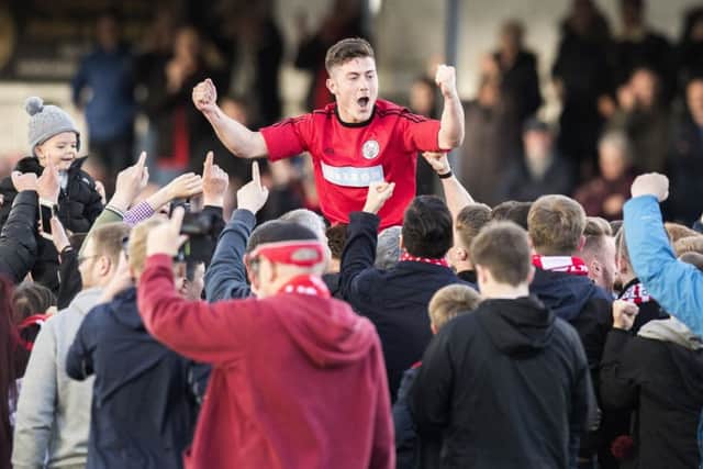 Brechin's Finn Graham celebrates with the fans at full time. Picture: Ross Parker