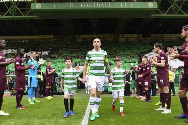 Celtic captain Scott Brown emerges from the tunnel as the Hearts players form a guard of honour. Picture: SNS