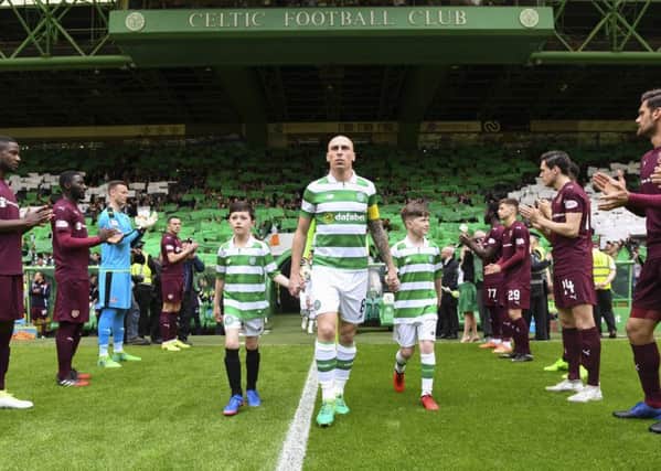Celtic captain Scott Brown emerges from the tunnel as the Hearts players form a guard of honour. Picture: SNS