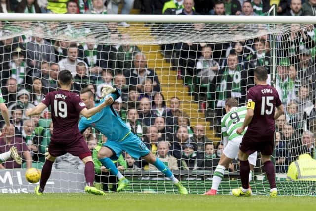 Leigh Griffiths nods past Viktor Noring for the game's only goal. Picture: SNS