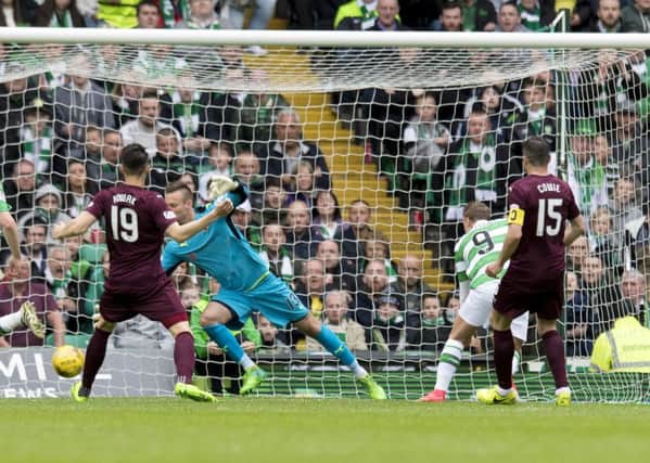 Leigh Griffiths nods past Viktor Noring for the game's only goal. Picture: SNS