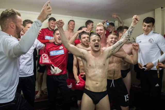 Brechin City players celebrate winning promotion to the Championship after defeating Alloa on penalties. Picture: SNS.