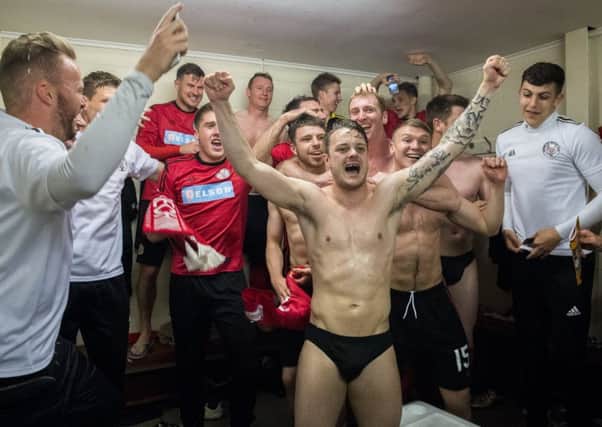Brechin City players celebrate winning promotion to the Championship after defeating Alloa on penalties. Picture: SNS.