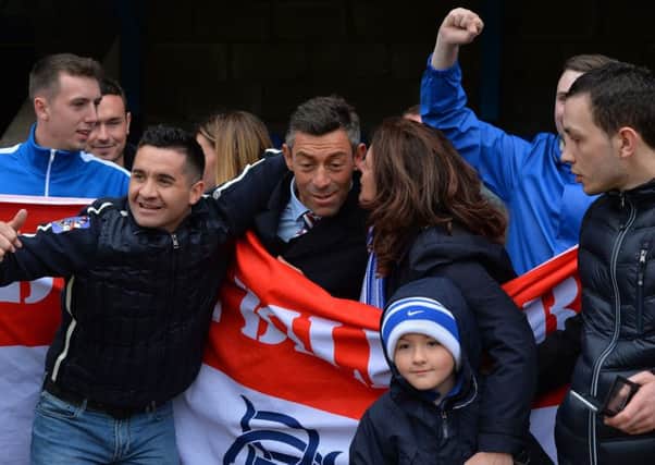 Rangers manager Pedro Caixinha is mobbed by fans after his side's 2-1 victory over St Johnstone. Picture: PA
