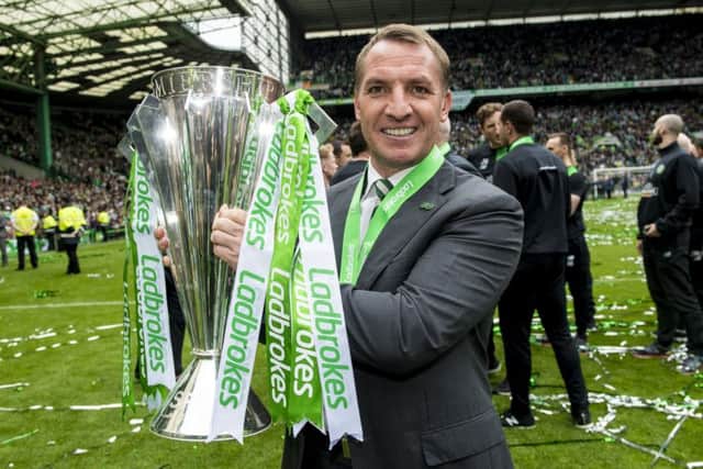 Celtic manager Brendan Rodgers with the Ladbrokes Premiership trophy. Picture: SNS