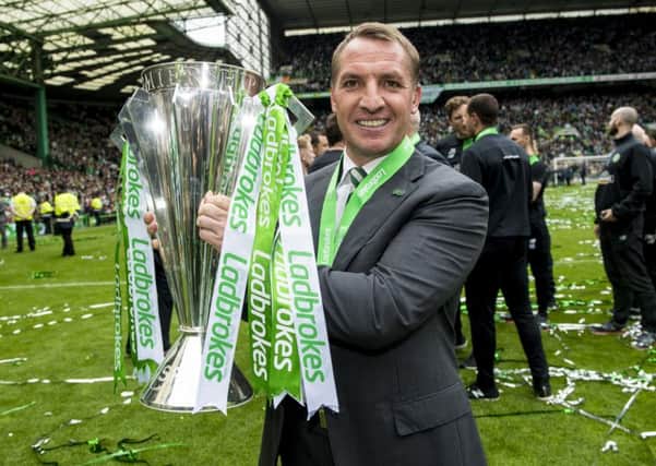 Celtic manager Brendan Rodgers with the Ladbrokes Premiership trophy. Picture: SNS