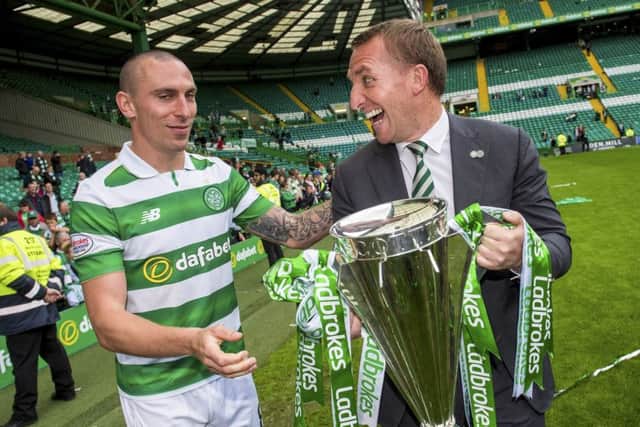 Brendan Rodgers and Scott Brown share a joke after full-time. Picture: SNS