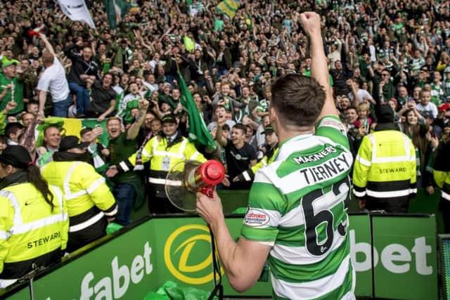 Kieran Tierney celebrates with the Celtic fans. Picture: SNS