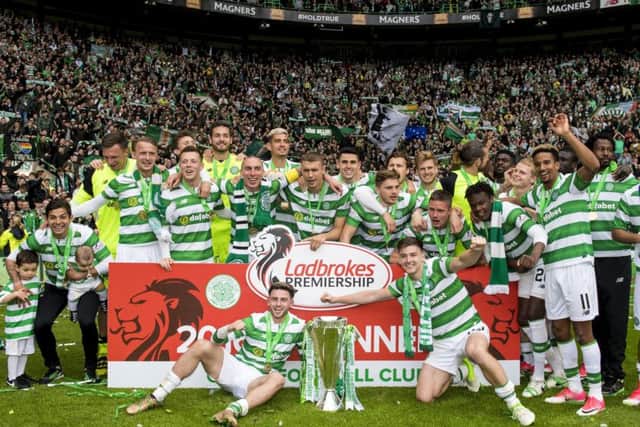 The squad celebrate in front of their fans. Picture: SNS