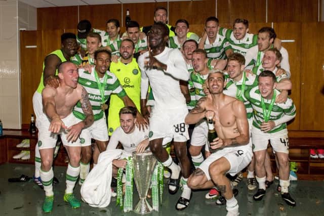 The Celtic players celebrate in the home dressing room. Picture: SNS