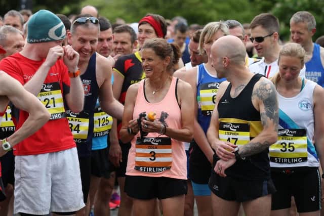 Zola Budd talks with fellow runners before the Stirling Marathon. Picture: PA.