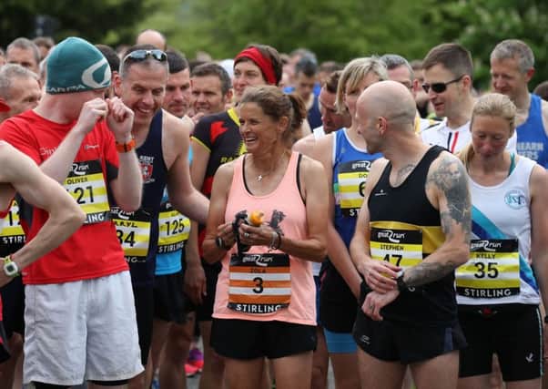 Zola Budd talks with fellow runners before the Stirling Marathon. Picture: PA.