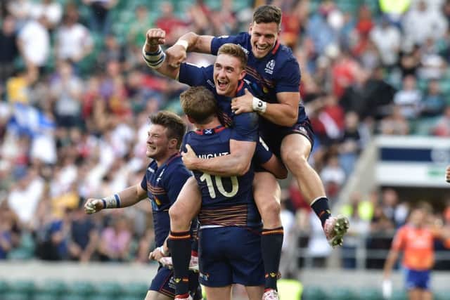 Scotland players celebrate seconds after beating England in the final at Twickenham yesterday. Picture: Charles McQuillan/Getty Images