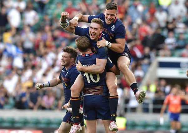 Scotland players celebrate seconds after beating England in the final at Twickenham yesterday. Picture: Charles McQuillan/Getty Images