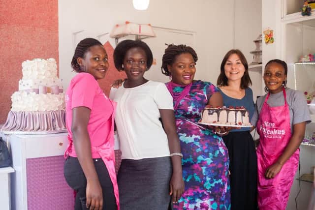An example of charity Challenges Worldwide's work, seen here with staff at a bakery in Uganda: Picture: Contributed