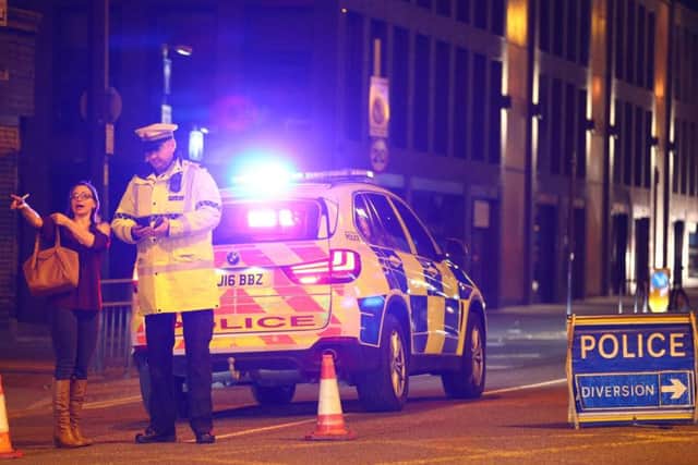 Police stand by a cordoned off street close to the Manchester Arena. Picture: Getty