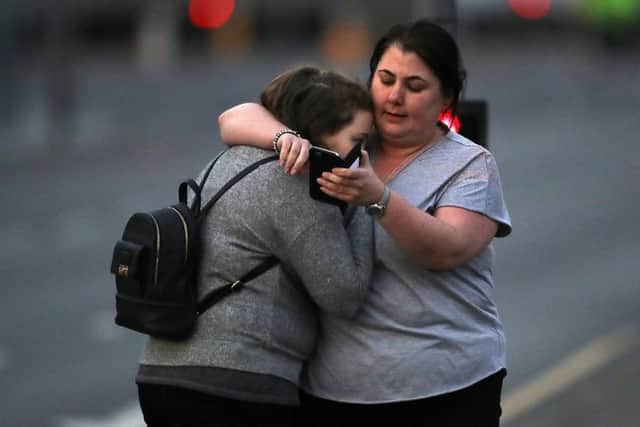 Ariana Grande concert attendees Vikki Baker and her daughter Charlotte, aged 13, leave the Park Inn where they were given refuge after last night's explosion at Manchester Arena. (Photo by Christopher Furlong/Getty Images)