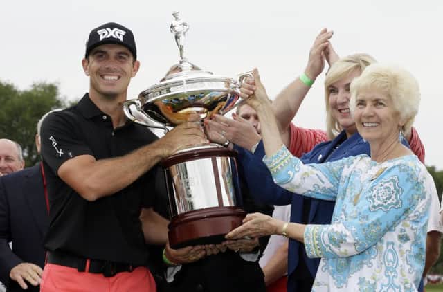 Billy Horschel was all smiles after receiving the AT&T Byron Nelson trophy from Peggy Nelson, widow of Byron Nelson. Picture: AP