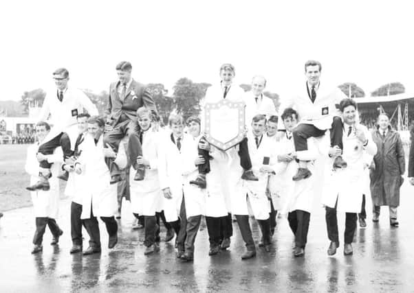 A view of the 1966 Royal Highland Show showing the Scottish team of young farmers with "The Scotsman" trophy