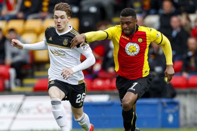 David Amoo, right, is one of five first-team players to exit Partick Thistle. Picture: SNS
