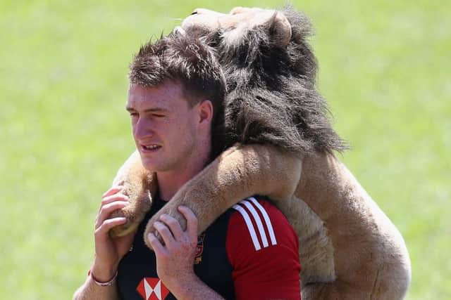 Stuart Hogg carries the Lions mascot, Billy, in 2013. Picture: David Rogers/Getty