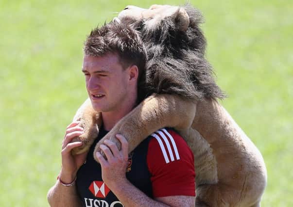 Stuart Hogg carries the Lions mascot, Billy, in 2013. Picture: David Rogers/Getty