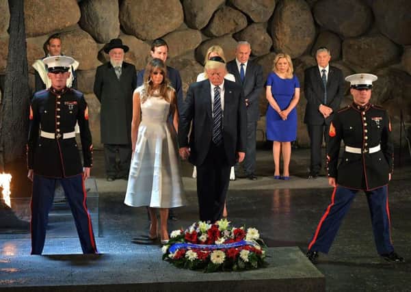 US President Donald Trump  and First Lady Melania Trump lay a wreath during a visit to the Yad Vashem Holocaust Memorial museum. Picture: Getty