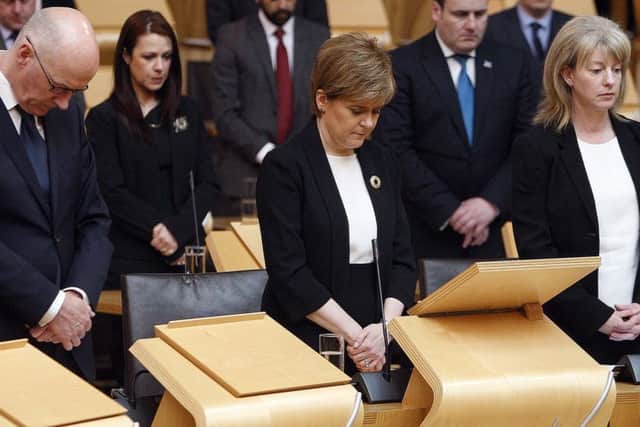 John Swinney, Nicola Sturgeon and Shona Robison joining MSPs from all parties in observing a minute's silence. Picture: PA
