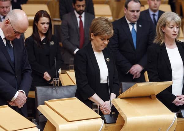 John Swinney, Nicola Sturgeon and Shona Robison joining MSPs from all parties in observing a minute's silence. Picture: PA