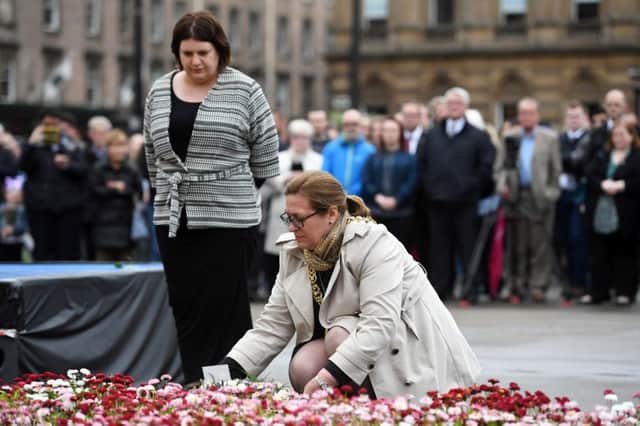 Glasgow city council leader Susan Aikten (left) and Lord Provost Eva Bolander lay floral tributes to the victims of the Manchester attack. Picture: SWNS