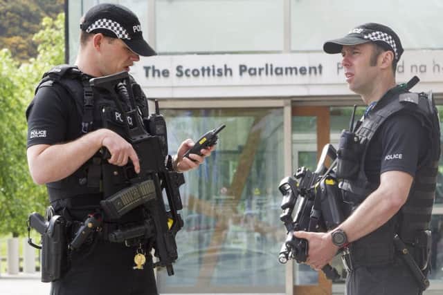 Armed Police outside The Scottish Parliament.