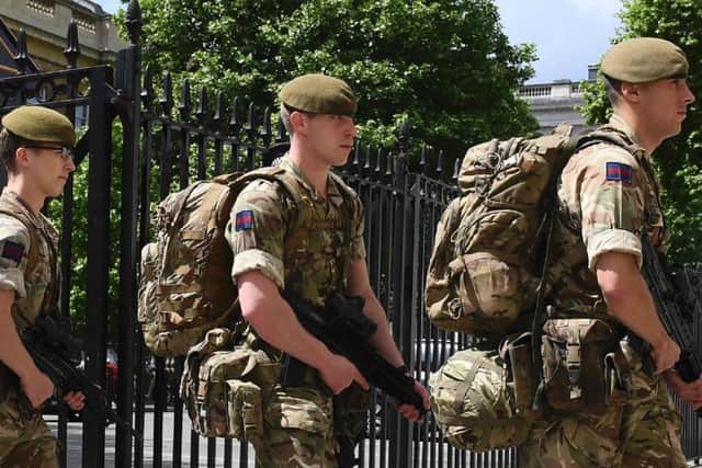 British soldiers enter a Ministry of Defence building near to New Scotland Yard. Picture: Getty