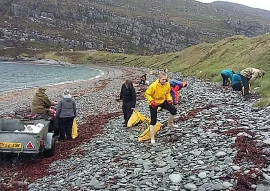 Volunteers collecting litter from Dun-Canna beach. Picture: Noel-Hawkins/Scottish Wildlife Trust