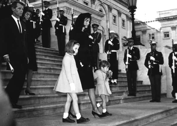 Jackie Kennedy with Caroline and John Jnr walk past a guard of honour at the  funeral of president John F Kennedy in 1963.