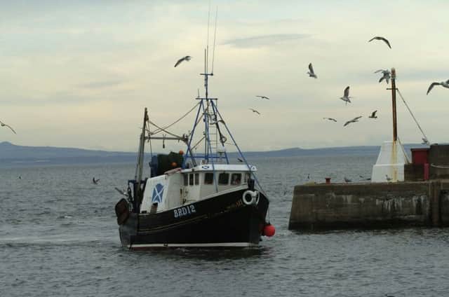 A fishing boat enters Port Seton. The value of fish landings reached a record high in 2016. Picture: Julie Bull/TSPL