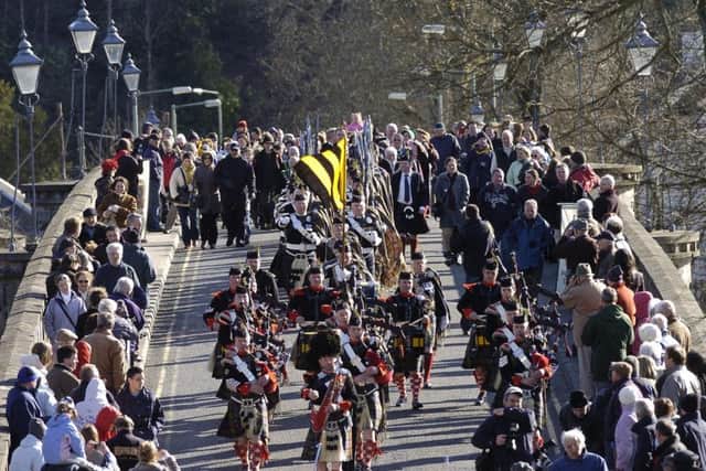 Blair Atholl Highlanders cross The Telford Bridge over the Tay at Dunkeld on the 200th Anniversary of the bridge in 2009. PIC: Robert Perry/TSPL