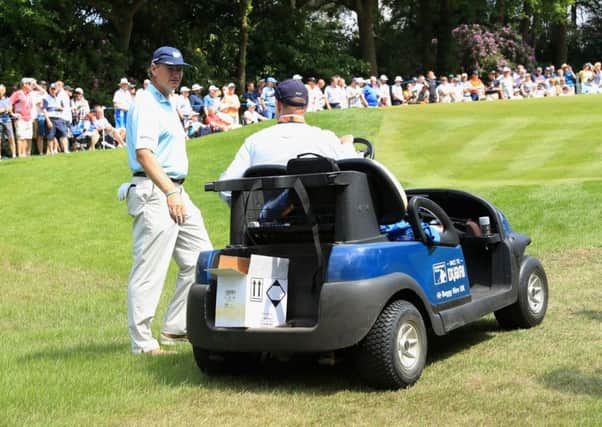 Ernie Els talks to rules official Simon Higginbottom on the 14th hole. Picture: Getty Images