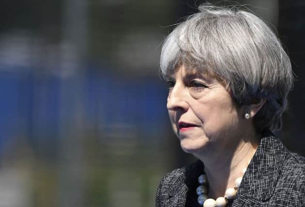 Theresa May has called on foreign recruits returning from IS to be brought to justice. Pic: AP Photo/Geert Vanden Wijngaert